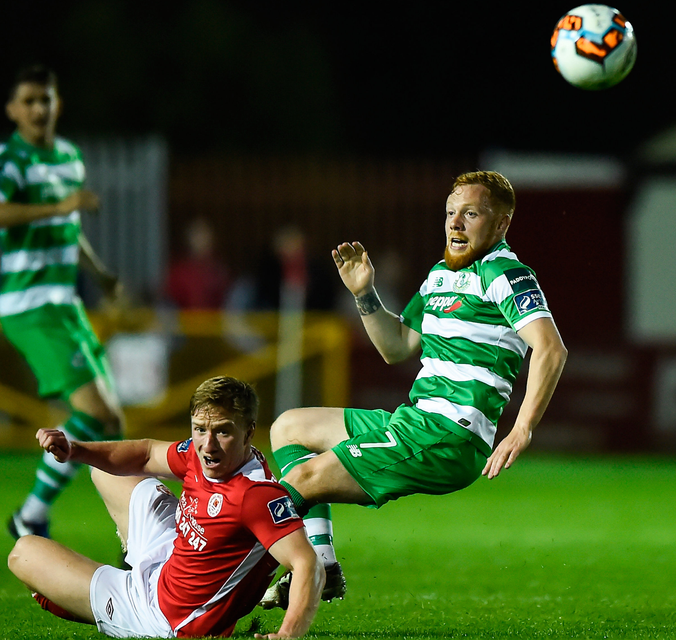 Shamrock Rovers' Ryan Connolly is tackled by St Patrick’s Athletic's Paul O’Conor. Photo: Sportsfile