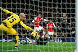 thumbnail: Arsenal's English striker Theo Walcott scores a goal beating Liverpool's Spanish goalkeeper Pepe Reina to take the score to 2-2 during the English Premier League football match between Arsenal and Liverpool at The Emirates Stadium, January 30, 2013