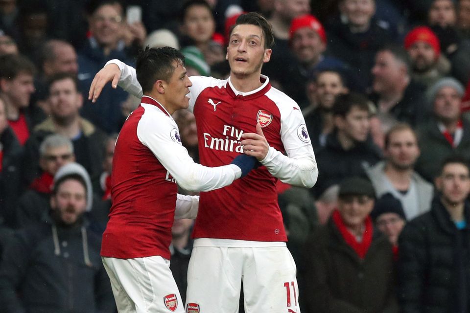 Alexis Sanchez (left) and Mesut Ozil are yet to extend their Arsenal contracts