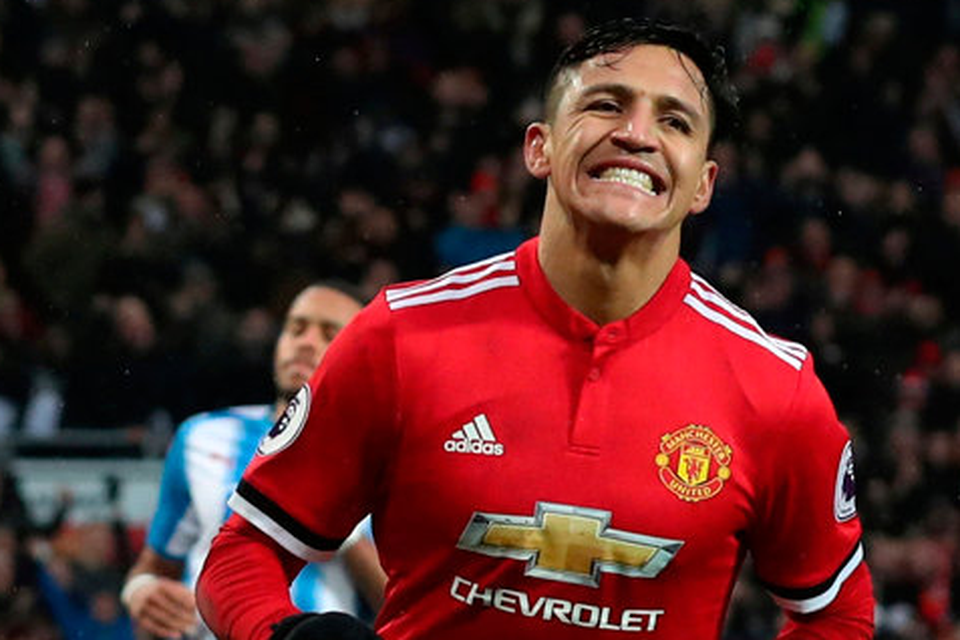 Alexis Sanchez celebrates after scoring Manchester United's winning goal against Huddersfield yesterday. Photo: Scott Heppell/Reuters