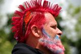 thumbnail: Festivalgoer Lindsay Mellor from Glastonbury shows off his Union Jack beard and haircut, a tribute to David Bowie