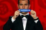 thumbnail: Former Russian player Aleksandr Kerzhakov holds up the slip showing ‘Ireland’ during the draw for the 2018 FIFA World Cup in St Petersburg, Russia