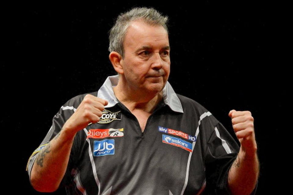 22 March 2011; Phil Taylor celebrates winning the opening leg against James Wade during the McCoy's Premier League Darts Tournament. O2, Dublin. Picture credit: Stephen McCarthy / SPORTSFILE