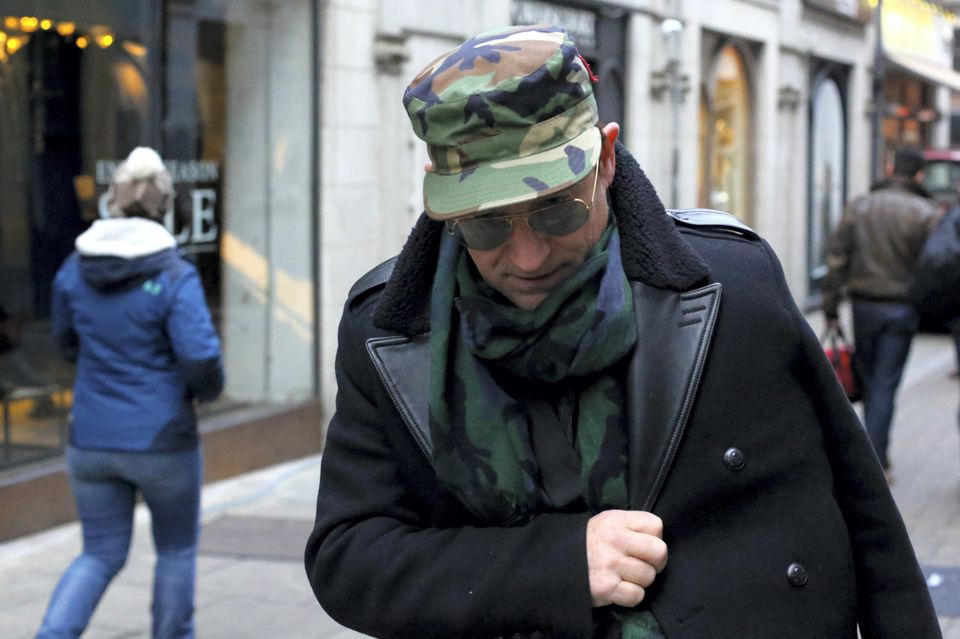 U2 frontman Bono nurses his injured arm as he walks down Grafton Street in Dublin on Saturday. Photo: Peter O’Doherty