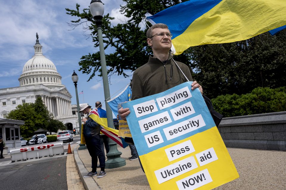 Activists supporting Ukraine, demonstrate outside the Capitol in Washington (J Scott Applewhite/AP)