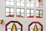 thumbnail: Stained-glass windows in the front doorway