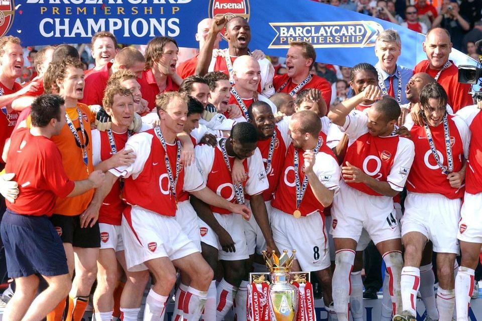 Arsenal players celebrate winning the Premier League title in 2004