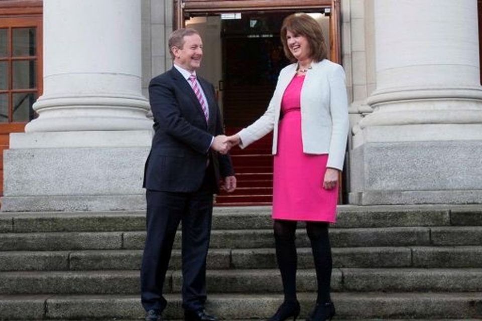 Taoiseach Enda Kenny TD & Tanaiste Joan Burton TD following a dissolution of the Dail at Government Buildings, Dublin. Photo: gareth chaney Collins