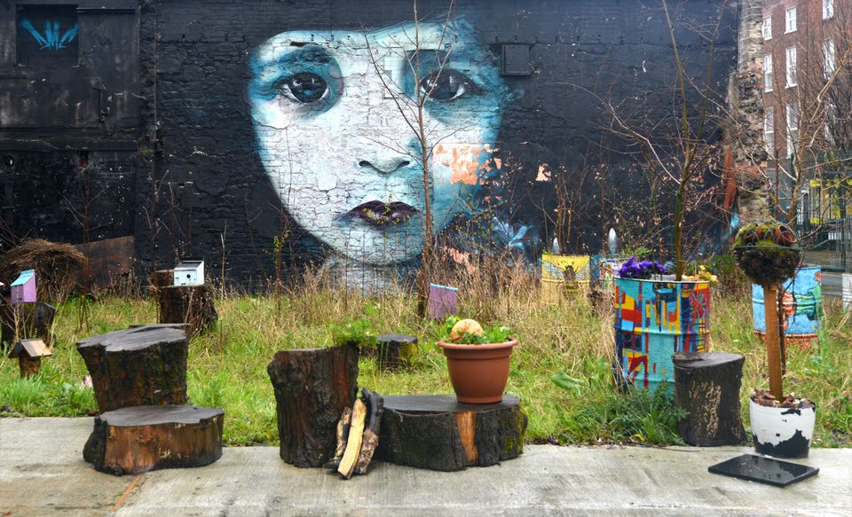 Street art in Limerick. The spectral child pictured is the work of Dermot McConaghy (DMC).