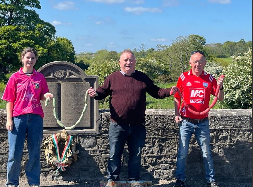 Peter Whelan (centre) with Aisling Mooney (in pink Meath jersey) and Frank Taaffe (Louth jersey) with the colourful sausages. Photo: Cian Ó Broin