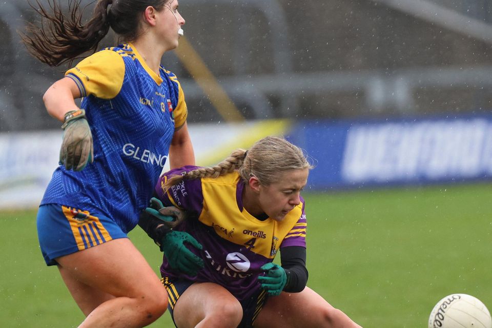 Katie English is first to the ball in this clash with Clodagh Lohan.