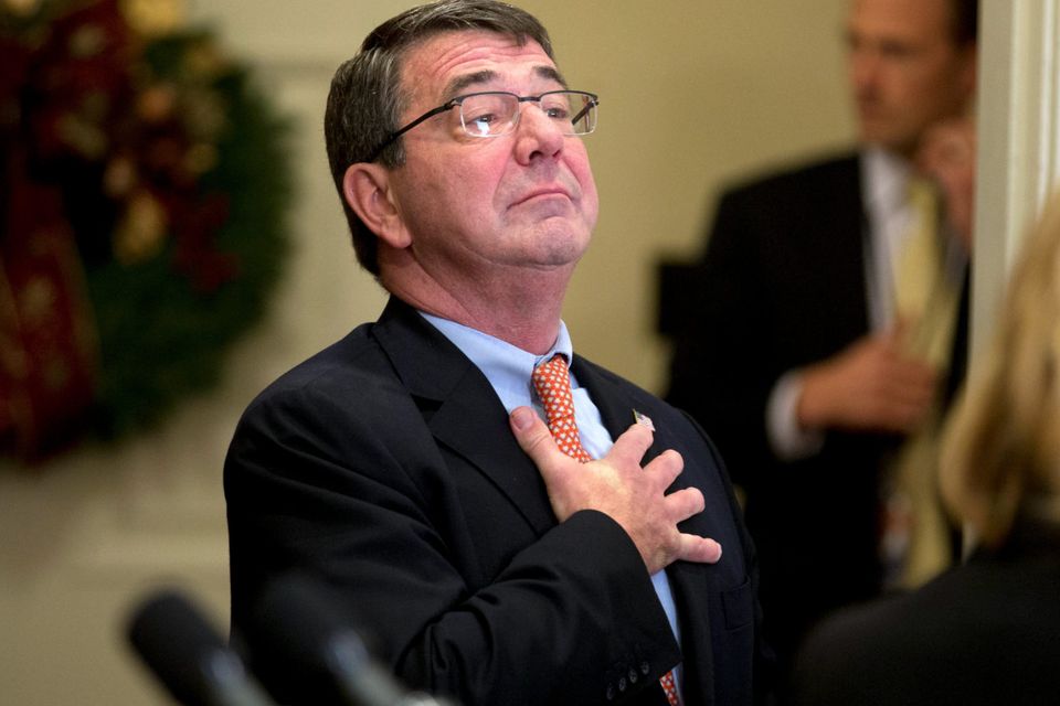 Ashton Carter, former deputy secretary of defense and U.S. President Barack Obama's nominee to be U.S. secretary of defense, places his hand over his heart after a nomination announcement with U.S. President Barack Obama, not pictured, in the Roosevelt Room of the White House in Washington, D.C., U.S., on Friday, Dec. 5, 2014. Carter, 60, spent more than two years as the Defense Department's No. 2 civilian leader under former