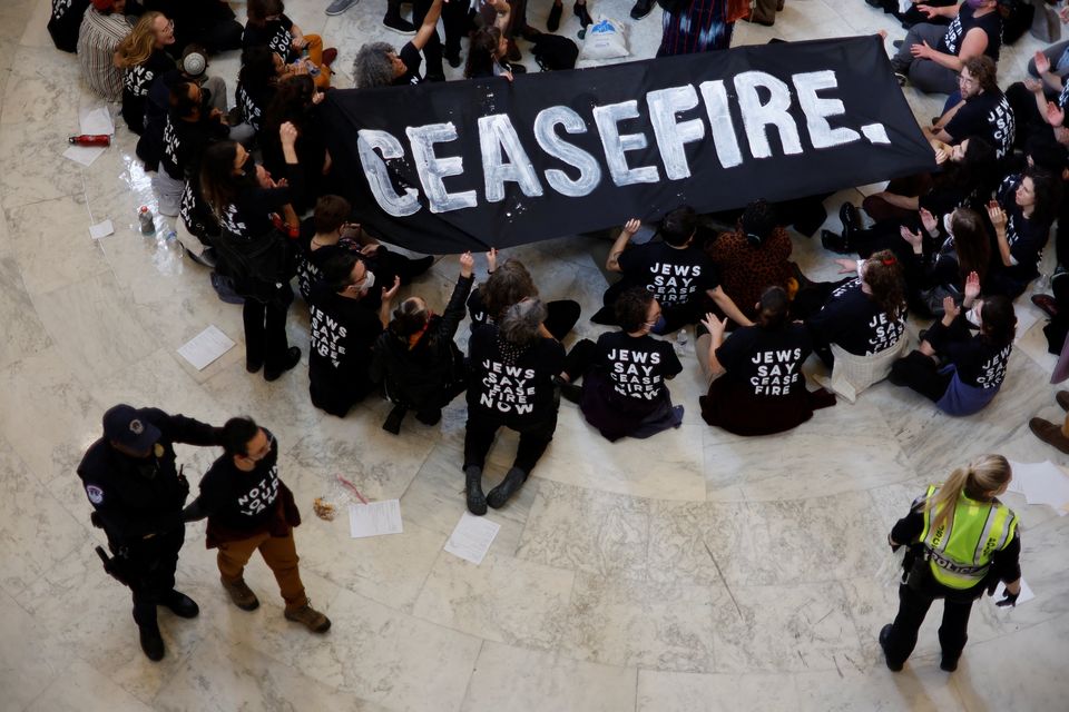 A protester is detained by Capitol Hill in Washington, US, police after calling for a ceasefire in Gaza and an end to the Israel-Hamas conflict occupied the rotunda of the Cannon House office building. Photo: Reuters