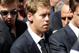 thumbnail: German Formula One driver Sebastian Vettel attends the funeral of French Formula One driver Jules Bianchi at the Sainte Reparate Cathedral during in Nice, French Riviera, Tuesday, July 21, 2015. Bianchi, 25, died Friday from head injuries sustained in a crash at last year's Japanese Grand Prix. He had been in a coma since the Oct. 5 accident, in which he collided at high speed with a mobile crane which was being used to pick up another crashed car. (AP Photo/Lionel Cironneau)