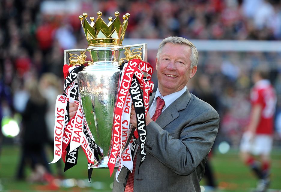 Alex Ferguson lifts the 2010-11 Premier League trophy (Martin Rickett/PA)
