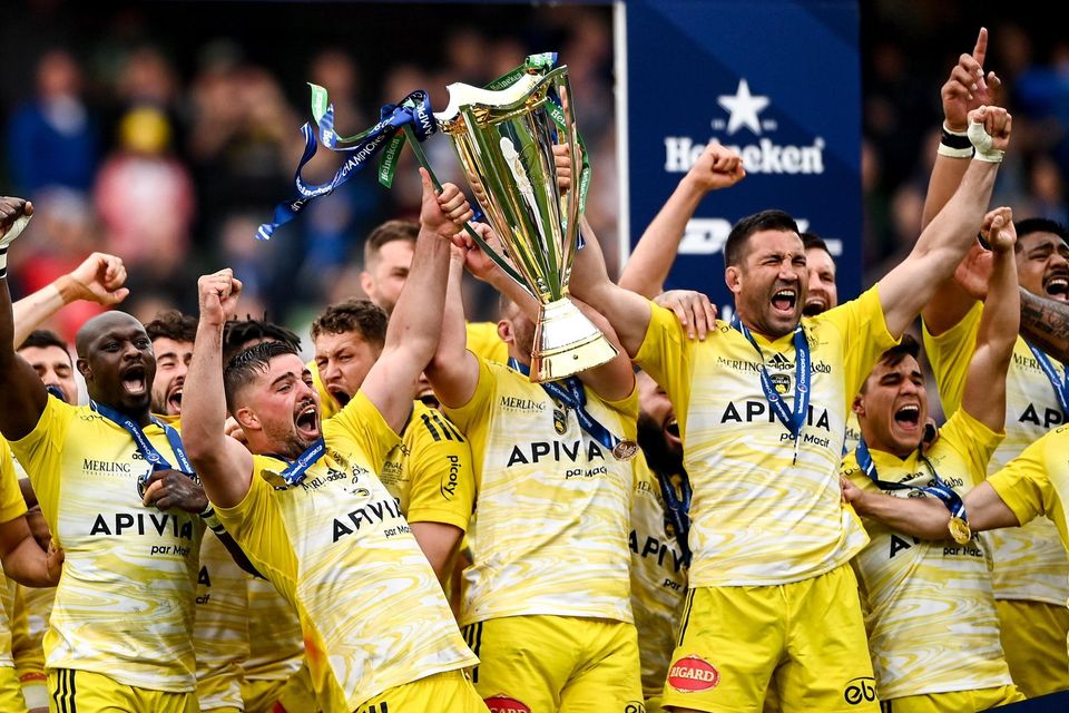 La Rochelle players celebrate with the Champions Cup after beating Leinster.