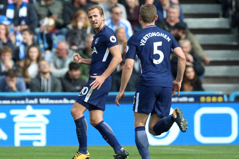 Harry Kane, left, was among the goals again at Huddersfield