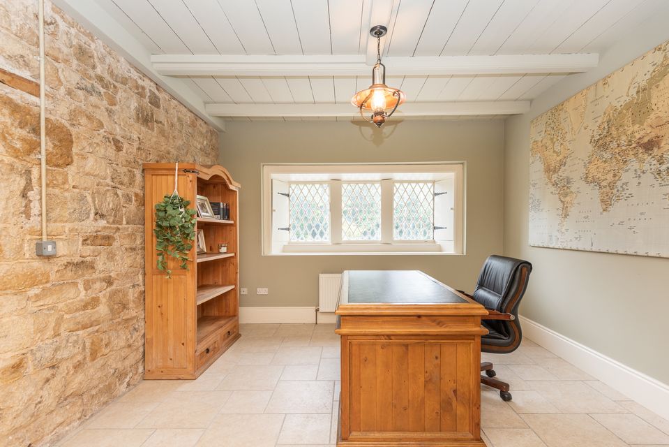 The home office with exposed cut-stone