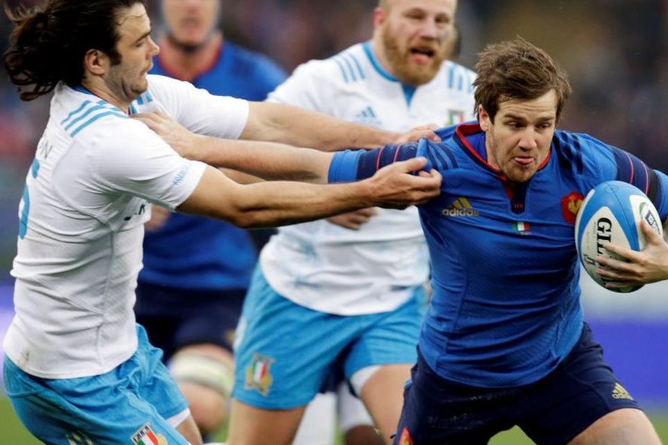 Frances Camille Lopez is tackled by Italy's Luke McLean at Rome's Olympic Stadium
