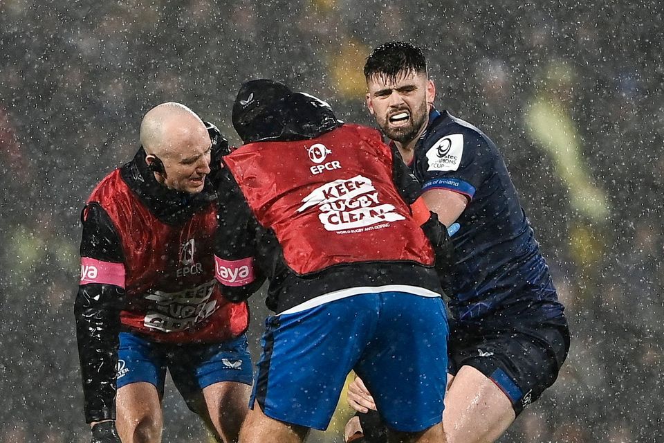 Leinster's Harry Byrne receives treatment during the Champions Cup match at La Rochelle on Sunday. Photo: Harry Murphy/Sportsfile