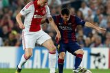 thumbnail: Barcelona's Lionel Messi (L) and Ajax Amsterdam's Kolbeinn Sigthorsson challenge for the ball during their Champions League soccer match at Camp Nou stadium in Barcelona October 21, 2014. REUTERS/Albert Gea (SPAIN  - Tags: SPORT SOCCER)