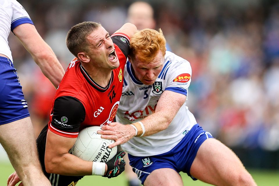 Down's Pat Havern is tackled by Monaghan's Ryan O'Toole during their All-Ireland SFC Round 3 tie at BOX-IT Athletic Grounds in Armagh. Photo: Thomas Flinkow/Sportsfile