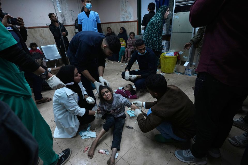 Palestinians wounded in the Israeli bombardment of the Gaza Strip are brought to Al Aqsa hospital in Deir al Balah, Gaza Strip, Thursday, Feb. 22, 2024. (AP Photo/Adel Han