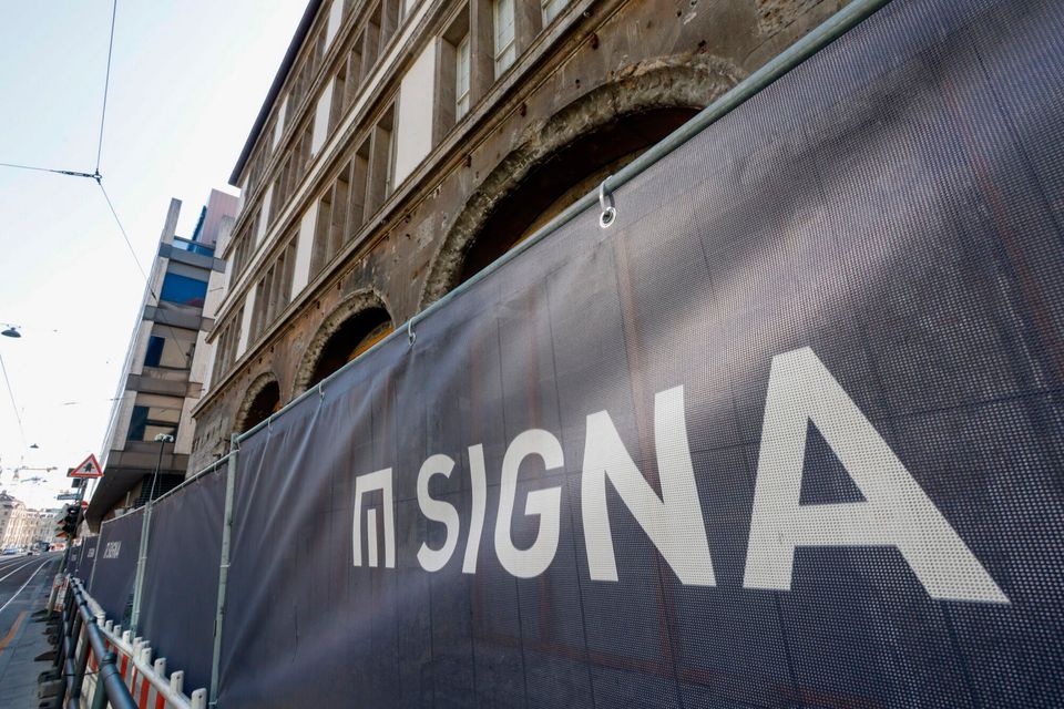 Hoardings with the Signa logo. Photo: Michaela Stache/Bloomberg