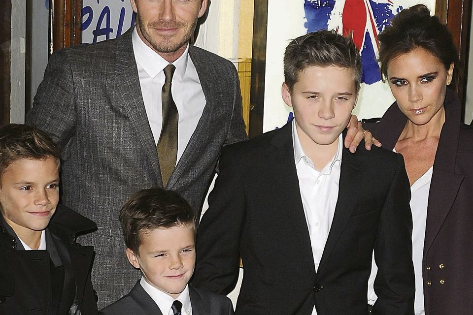 David and Victoria Beckham with their children (left to right) Romeo, Cruz and Brooklyn. Photo: PA