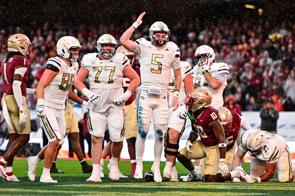 24 August 2024; Georgia Tech Yellow Jackets quarterback Zach Pyron celebrates after scoring his side's first touchdown during the 2024 Aer Lingus College Football Classic match between Florida State and Georgia Tech at Aviva Stadium in Dublin. Photo by Ben McShane/Sportsfile 