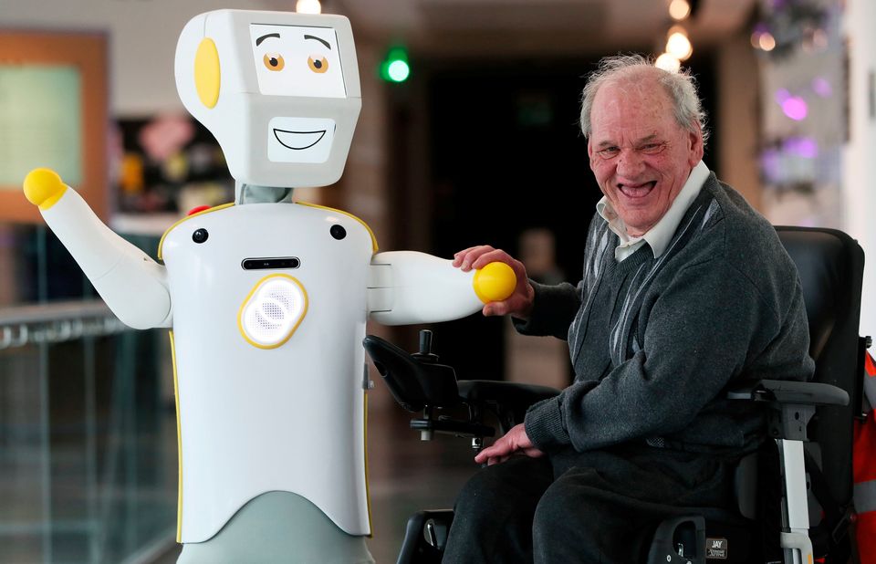 IrelandÕs first socially assistive AI robot 'Stevie II' from robotics engineers at Trinity College Dublin, with Brendan Crean, who helped trial the robot through the charity ALONE, during a special demonstration at the Science Gallery in Dublin. 
Brian Lawless/PA Wire