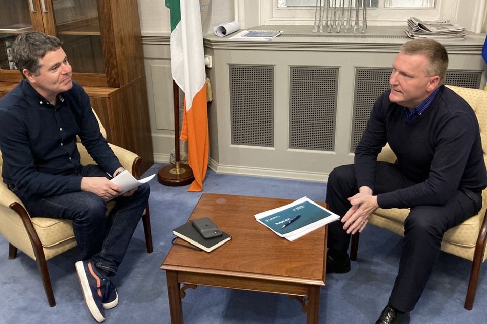 Big decisions: Finance Minister Paschal Donohoe issued this photo of his last-minute Budget discussions with Minister for Public Expenditure and Reform Michael McGrath last night, promising: ‘Our country is dealing with many challenges but we are equipped to rise to them. And we will.’