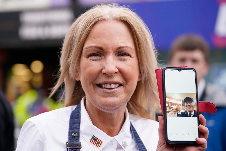 Patricia Moriarity with a selfie of herself and US President Joe Biden during his walkabout through Dundalk, Co Louth, during his trip to the island of Ireland, She works in the food house restaurant that Joe visited. Picture date: Wednesday April 12, 2023. PA Photo. See PA story IRISH Biden. Photo credit should read: Niall Carson/PA Wire