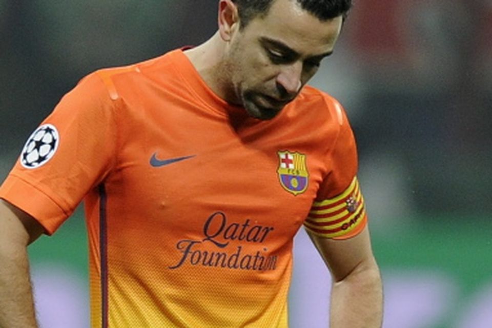 MILAN, ITALY - FEBRUARY 20:  Xavi Fernandez of FC Barcelona dejected during the UEFA Champions League Round of 16 first leg match between AC Milan and Barcelona at San Siro Stadium on February 20, 2013 in Milan, Italy.  (Photo by Claudio Villa/Getty Images)