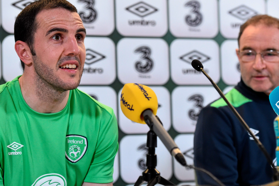 Republic of Ireland’s John O’Shea with manager Martin O’Neill during a press conference at the Aviva Stadium yesterday.