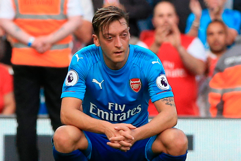 Arsenal's Mesut Ozil shows his dejection after the final whistle at Anfield. Photo: Peter Byrne/PA