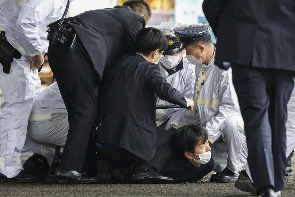 The suspect is held down by police after the incident. Photo: JPN/Wakayama.
