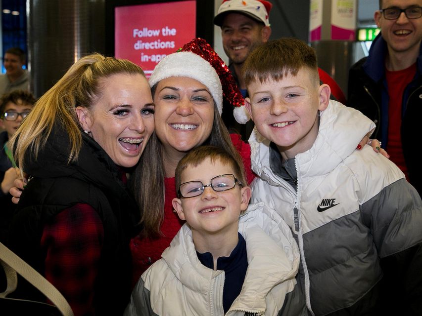 (L to R) Erica Fitzpatrick from Lucan, Courtney Kruger from San Francisco, Bradley Fitzpatrick (7) from Lucan and Nathan Fitzpatrick (12) from Lucan at Dublin Airport. Photo: Gareth Chaney/ Collins Photos