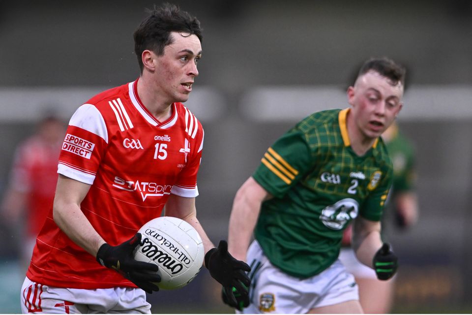 Louth's Kieran McArdle and Conor Ennis of Meath during Monday night's Leinster U20 FC final at Parnell Park.