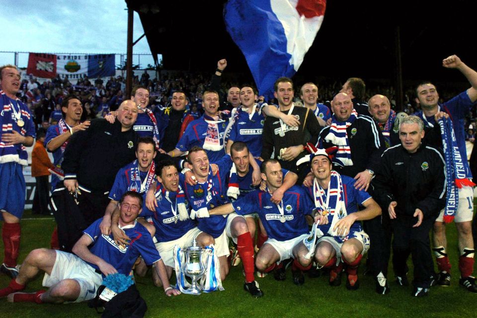 Linfield players and staff celebrate at the end of the game after victory over Shelbourne in the 2005 Setanta Cup Final at Tolka Park in Dublin. Picture credit; David Maher / SPORTSFILE
