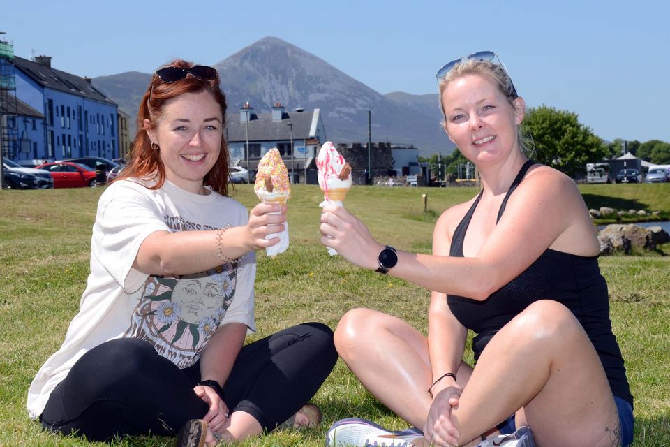 Lisa Gibbons and Triona Pastura enjoy an ice-cream in the sun in Westport, Co Mayo. Photo: Paul Mealey
