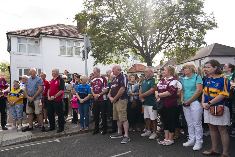 Members of the Irish community gathered in Greenford, west London, to pray and lay flowers after Thomas O’Halloran was killed (Kirsty O’Connor/PA)