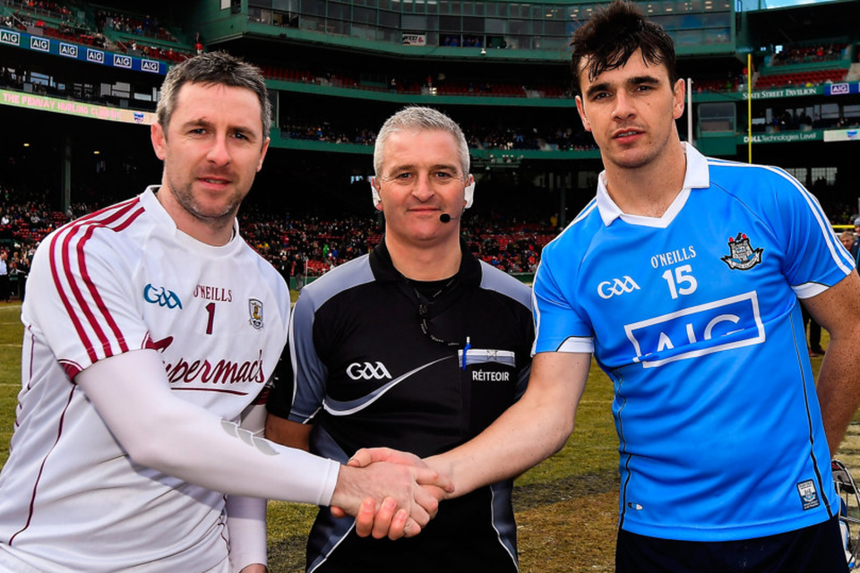 Team captains Colm Callanan of Galway and Danny Sutcliffe of Dublin with referee Johnny Ryan before the AIG Super 11’s Fenway Classic Semi-Final match between Dublin and Galway at Fenway Park in Boston. Photo: Sportsfile