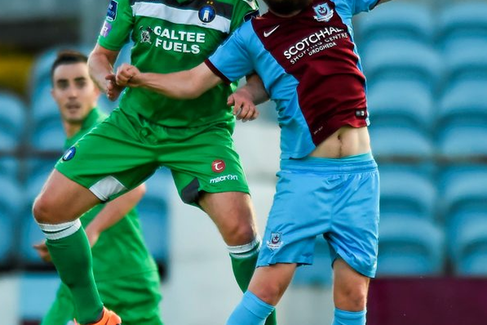 Drogheda's Tiernan Mulvenna in action against Robbie Williams of Limerick
