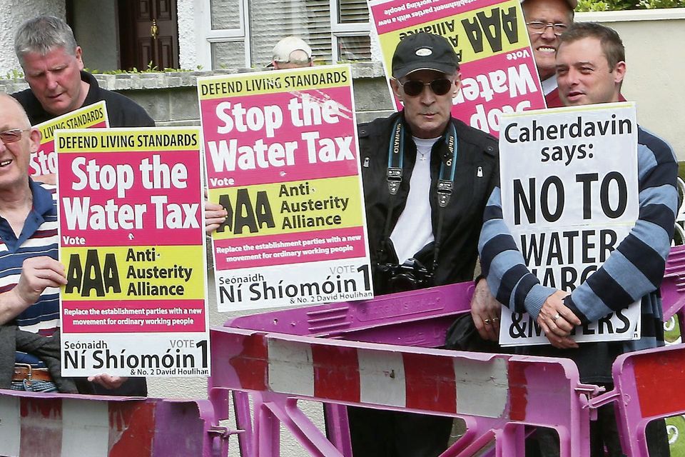 Anti-water metre protesters block Irish Water workers from installing meters on the Ennis Road, Limerick.