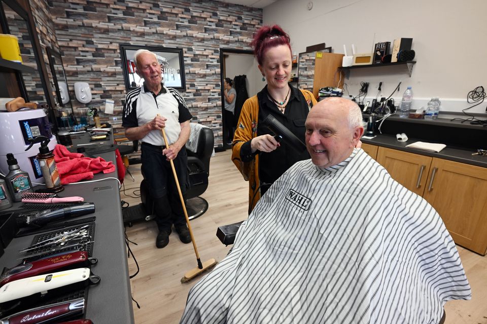 Walter Francis (left) with his daughter Maggie and PJ Haverty at Maggie's Barbers in Athenry. Photo: Ray Ryan