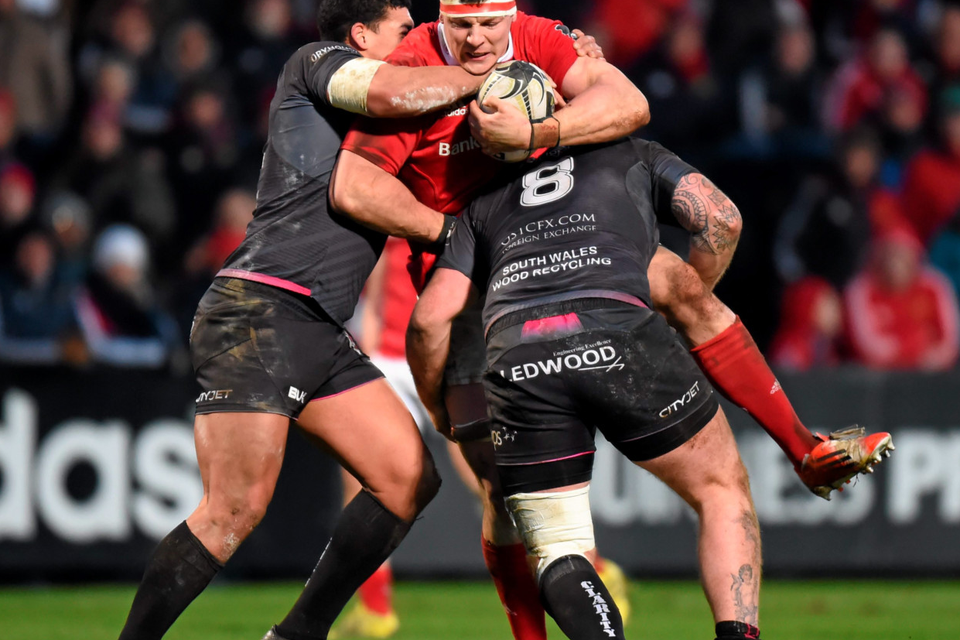 Munster’s Robin Copeland is tackled by Ospreys duo Josh Matavesi, left, and Dan Baker during last weekend’s Pro 12 clash at Irish Independent Park. Photo: Sportsfile