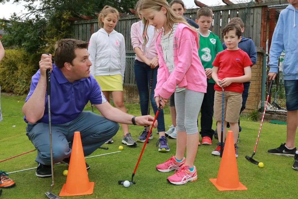 David Lavelle, a PGA Pro who runs the golf camp at Spawell Golf Centre, teaches Riona
Monadhan (9) from Rathmines