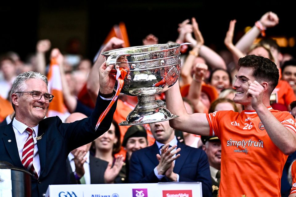 GAA president Jarlath Burns celebrates with his son Jarly Óg after Armagh lifted the Sam Maguire Cup at Croke Park last July. Photo: Sportsfile