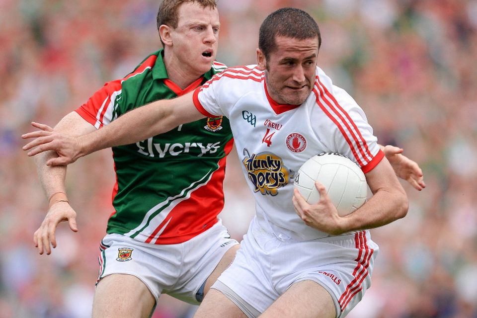 Stephen O'Neill, Tyrone, in action against Colm Boyle